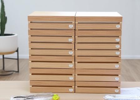Neatly stacked flat-pack kitchen components ready for assembly.